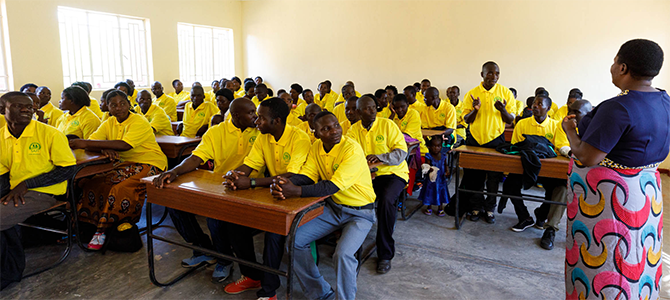 670x300_Day3_04_NuSkin A class of students at the School of Agriculture for Family Independence (SAFI) in M’bwatalika listen to their teacher.