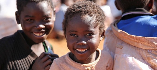 vitameal bags article - 01 smiling children in Malawi
