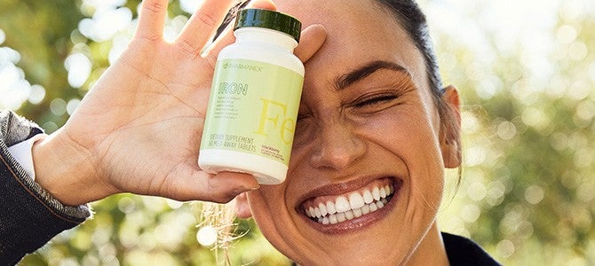 Iron Supplement - In-Article Image 03 women holding Pharmanex Iron Supplement by Nu Skin