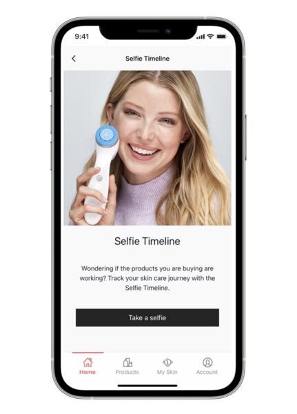 A screenshot from the Nu Skin Vera app of someone holding the LumiSpa iO